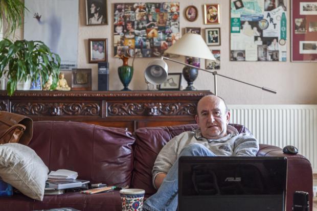 Isle of Wight County Press: John Armstrong relaxing at home. Photo: Julian Winslow.