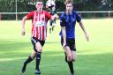 Cory Sanderson, left, in action for East Cowes Vics against Clanfield in September.