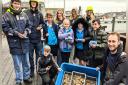 Children from Lanesend Primary and the UKSA and project lead, Eric Harris-Scott, bottom right, with the oysters
