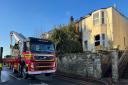 One hurt and road closed after Brading house fire