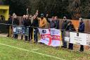 Cowes Sports fans cheer on their side.