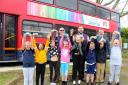 St Helens Primary School pupils receive their bus tickets next to their library bus - also donated by Southern Vectis