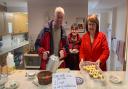 Barbara Conway (right) and Newport parishioners selling cakes after Sunday Mass to raise money for their youth group.