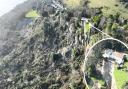 The landslip and a close up of one of the affected properties.