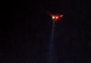 A Solent Coastguard helicopter using a searchlight over East Cowes harbour last night (Saturday).