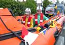 Adam, nine, and Timmy, seven, in the D class inshore lifeboat at the Bembridge Street Fair