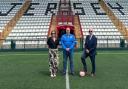 Jonathan Le Fondre, of the Jersey FA, flanked by Tanzy Cherry, chief operating officer, and David Cherry, CEO, both of tournament sponsors Cherry Godfrey, in Jersey.
