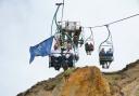 The NCI flag taking a ride on a chairlift at The Needles