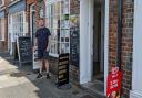 Neil Mason, co-owner of Town Choice in Newport, has seven signs outside his cafe