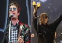 Noel and Liam Gallagher performing at Isle of Wight Festival