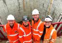 Standing in front of one of the massive new storm tanks are, from left, Dan Attrill, of C45, Steve Burton, of Wight Building Materials, John Pitfield, of Galliford Try, and Cameron Davies, of Active Tunnelling.