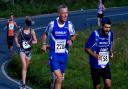 Returning runners David Saunders, centre, alongside his friend Damian from Dursley Running Club in the 2016 IW Marathon