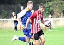 Josh Neale (with the ball) was on target for East Cowes Vics at Fawley.