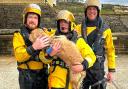 Ted the dog showing his gratitude to his rescuers, of Freshwater Independent Lifeboat