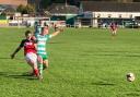 John McKie (wearing red) bagged a hat-trick at Laverstock & Ford.