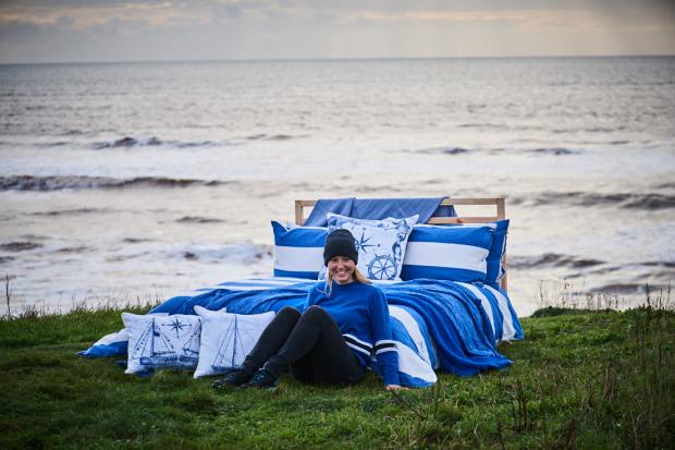 Izzey Hung of Isle of Wight-based company, XVstripes, with her signature Cowes duvet collection. XVstripes will have space in John Lewis from the end of September 2022.