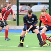 Tom Young (in blue) scored twice for the Isle of Wight Men's seconds on Saturday.