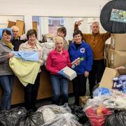 Volunteers sorting donations to send to Ukraine.