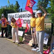 Teachers on strike outside of Christ the King College on Friday, July 7