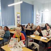 Lucy Morgan, co-editor of the Isle of Wight County Press, centre, with a group of Island VI Form students