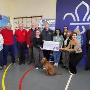Abi and Regan from Performance in People, and Mavis, with the WightAID cheque and some of the organisations which benefitted.