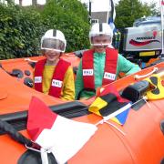 Adam, nine, and Timmy, seven, in the D class inshore lifeboat at the Bembridge Street Fair