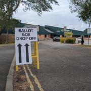 Sign showing where the ballot boxes will go.