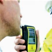 Police carrying out a roadside breath test.
