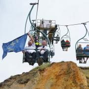 The NCI flag taking a ride on a chairlift at The Needles