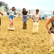 Action from the ladies' sack race