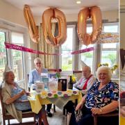 Beryl with her family and pictured with her 100th birthday cake