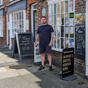 Neil Mason, co-owner of Town Choice in Newport, has seven signs outside his cafe