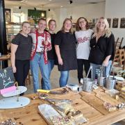 Staff at Richmond's Bakery selling cakes at the front of the shop.