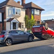 The red car ended up in an unusual position