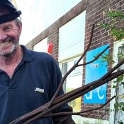 Dave Badman putting the finishing touches on the sculpture in Sandown