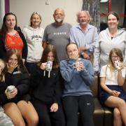 (From left, Freshwater Parish Council Chair Cllr Emma Cox, Volunteers Tammy, Andrew and Gary and Cllr Natalie Thomas and Faye. Front row young people from left, Maddie, Rosie, Sophie, Grace and Gia.)