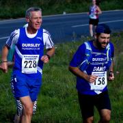 Returning runners David Saunders, centre, alongside his friend Damian from Dursley Running Club in the 2016 IW Marathon