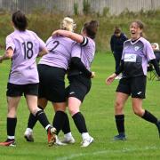 The team celebrates with goalscorer Georgie Dye, number two