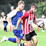 Josh Neale (with the ball) was on target for East Cowes Vics at Fawley.