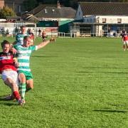 John McKie (wearing red) bagged a hat-trick at Laverstock & Ford.