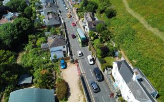 Traffic on Leeson Road after it reopened for the first time in seven months.