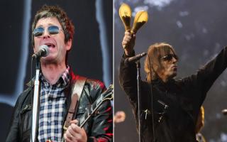 Noel and Liam Gallagher performing at Isle of Wight Festival