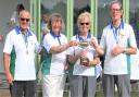 Ryde Marina Bowling Club co-event organiser, Anne Hoath,  presenting the Frank Sansom Trophy to Liz Allen, of the winning trio, with team-mates Dave Wolton, left, and John Wright.