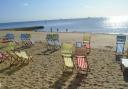 Deckchairs on the beach.