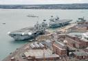 HMS Prince of Wales berths alongside HMS Queen Elizabeth at Portsmouth Naval Base