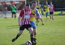East Cowes Vics' Raff Boyd-Kerr sees off challenge from Port's Joe Butcher in the derby on Good Friday