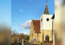 The iconic white tower at the church in Newchurch