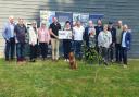 Geoff Underwood, founder and chairman of WightAID, left, with trustees and representatives of Island causes which received donations.