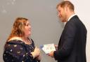 Islander Angela Turner shares a light moment with Prince Harry.