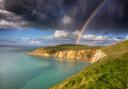 A bright evening rainbow over Alum Bay.